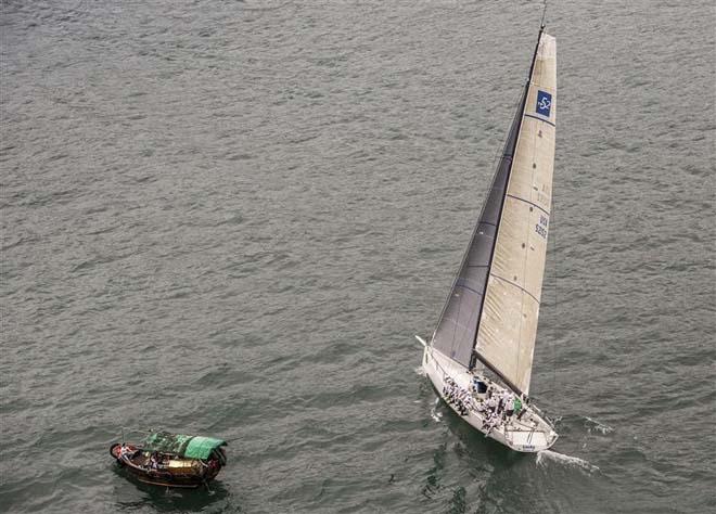 TP52 LUCKY passing a traditional boat following the race start in Hong Kong &copy;  Rolex/ Kurt Arrigo http://www.regattanews.com